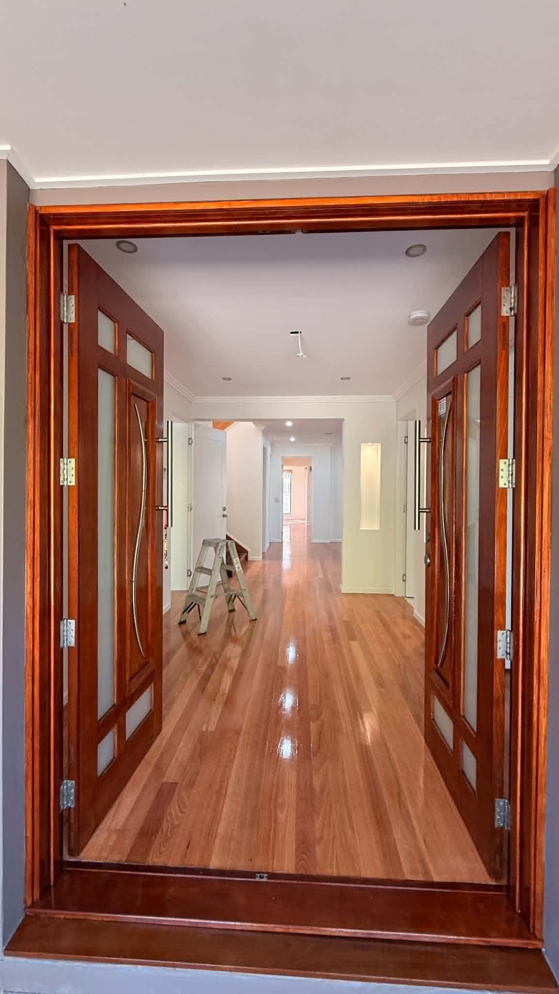 High-gloss accent entry door frame painting with clean cut-ins in Brisbane