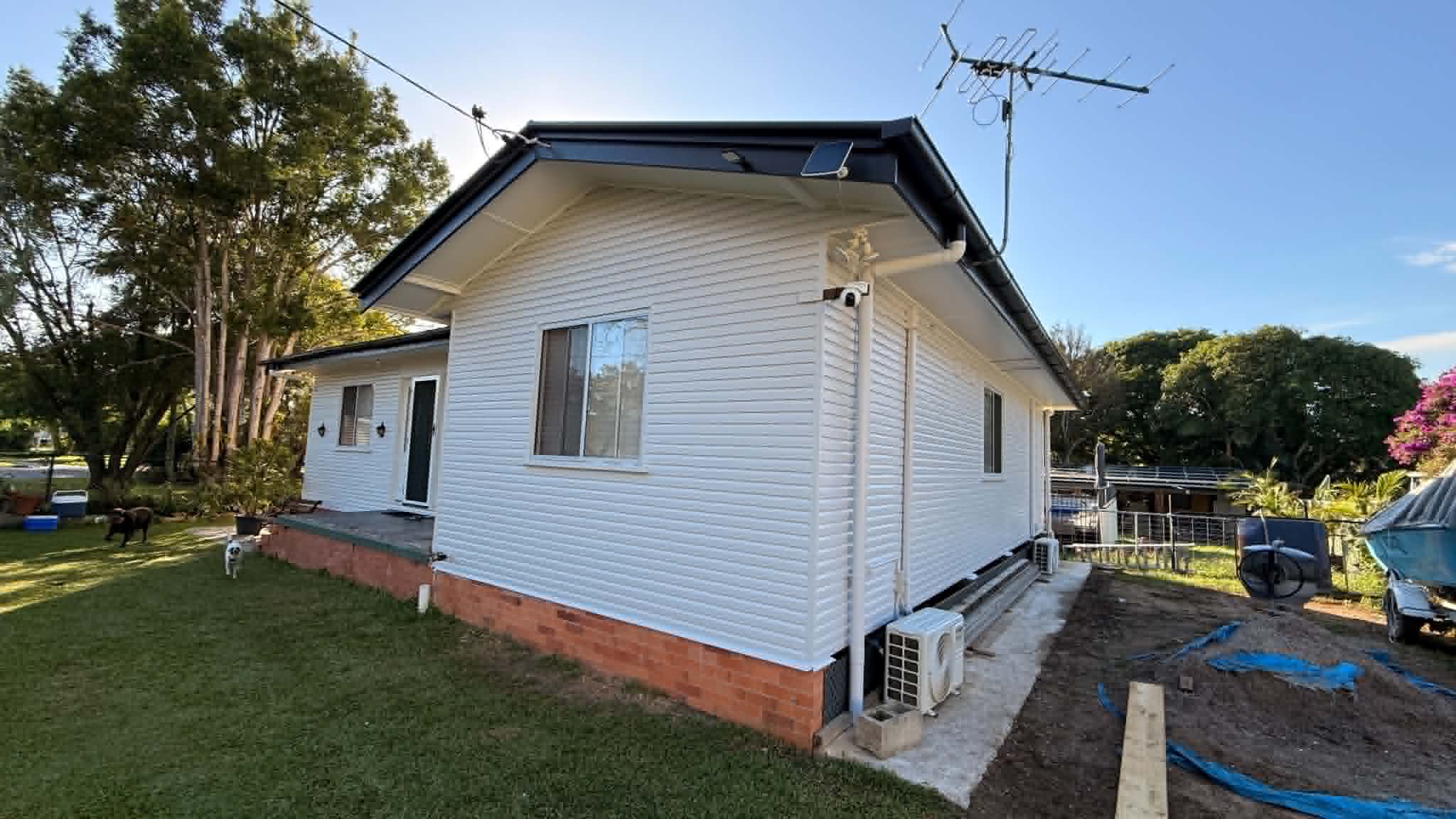 Queenslander exterior timber cladding prep and dual-coat acrylic in Brassall