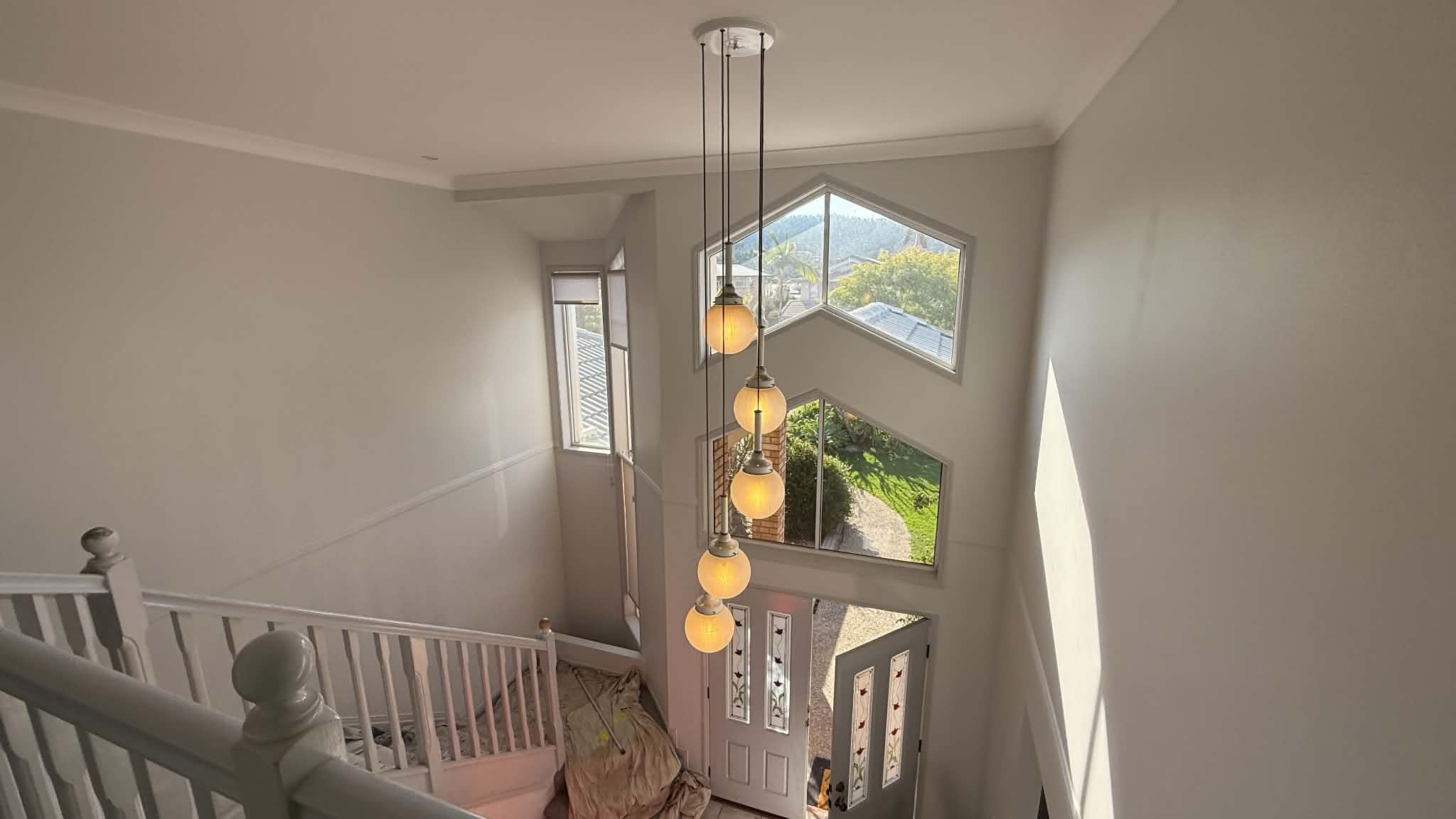 Interior house wall and ceiling painting with clean edge lines in Brisbane
