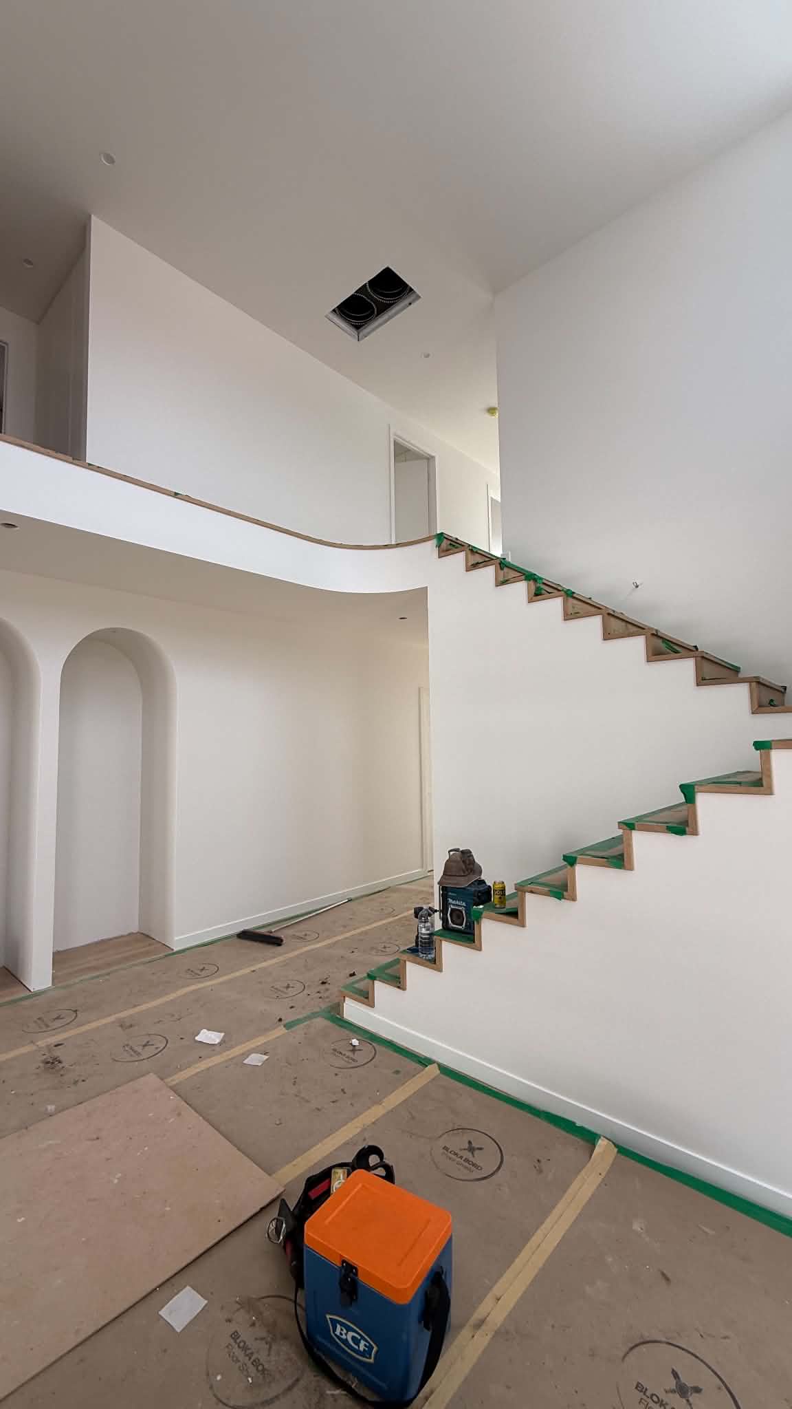 Hand-painted white timber staircase balustrades and risers in Carindale
